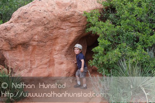 Michael Weber plays on a rock in Garden of the Gods Park in Colorado Springs, CO